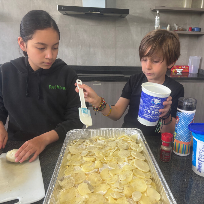 Students make food for teachers