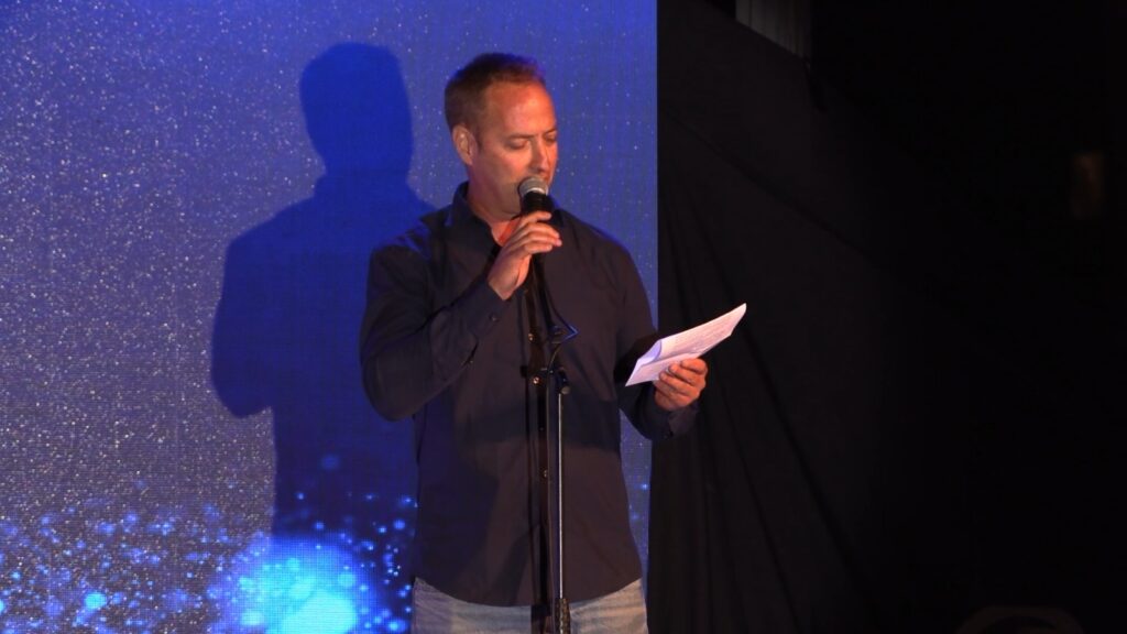 Amos Gofer gives a speech